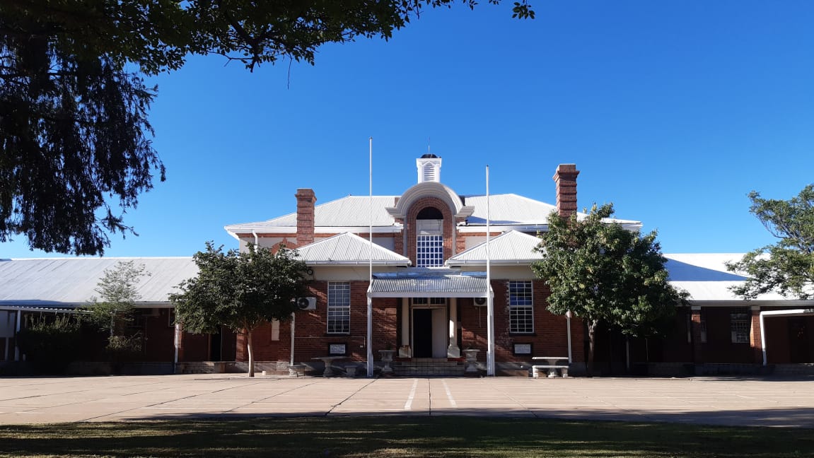 Front view of Vryburg High School main building in summer, Vryburg, North West, South Africa.