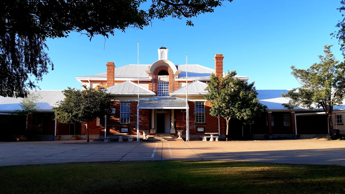 Front view of Vryburg High School main building in the afternoon sunlight, Vryburg, North West, South Africa
